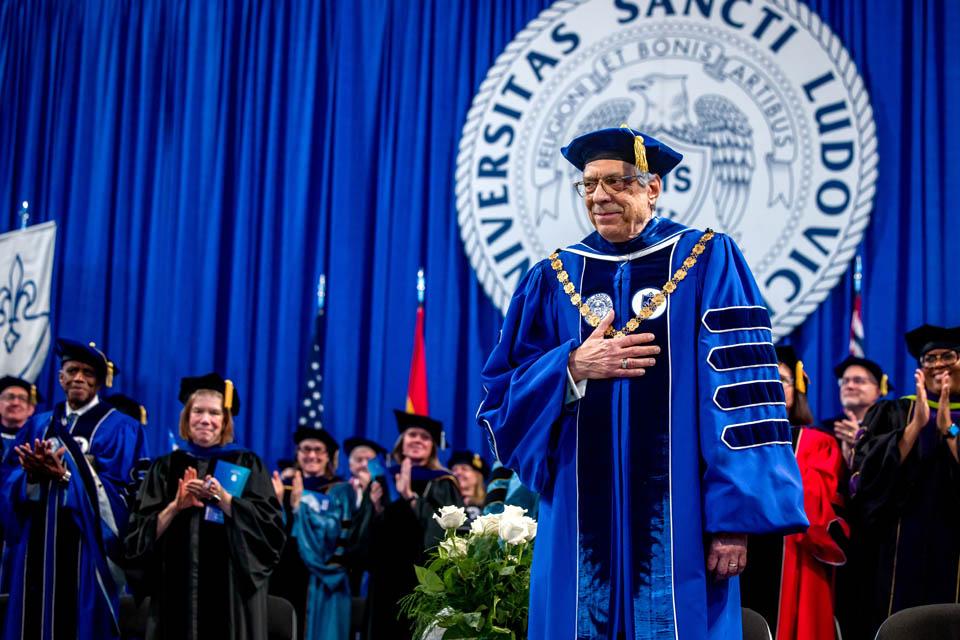 President Fred P. Pestello, Ph.D., receives a standing ovation from the stage party following his address during Commencement on May 17, 2025. Photo by Sarah Conroy.