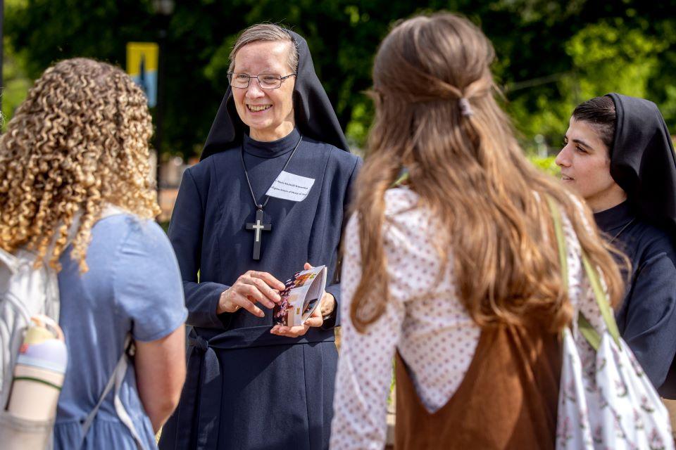 SLU students talk to nuns during a vocation fair on campus April 25. Photo by Sarah Conroy.