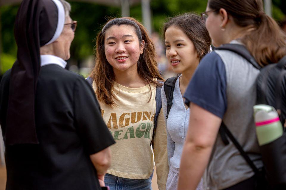 SLU students talks to a nun during a vocation fair on campus April 25. Photo by Sarah Conroy.