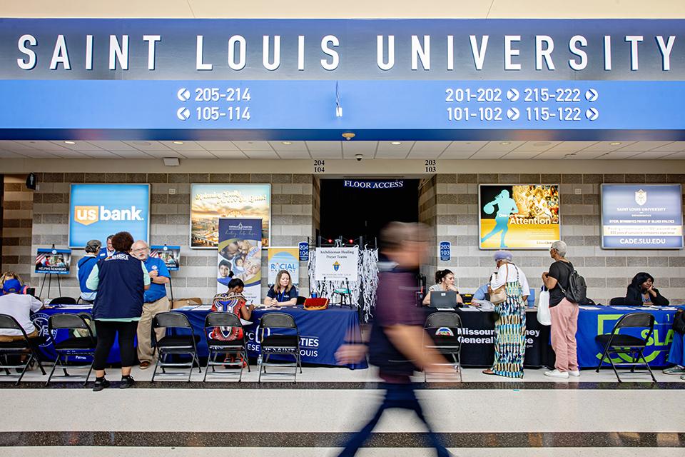 Survivors of the May 16 tornado receive support at the Disaster Assistance Center in Chaifetz Arena on June 17, 2025. The DAC, which serves as a central space for tornado-affected residents to connect with agencies and resources, is a partnership between the City of St. Louis, Missouri State Emergency Management Agency and SLU. Photo by Sarah Conroy.