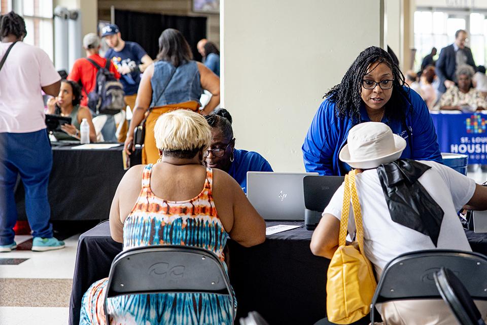 Survivors of the May 16 tornado receive support at the Disaster Assistance Center in Chaifetz Arena on June 17, 2025. The DAC, which serves as a central space for tornado-affected residents to connect with agencies and resources, is a partnership between the City of St. Louis, Missouri State Emergency Management Agency and SLU. Photo by Sarah Conroy.