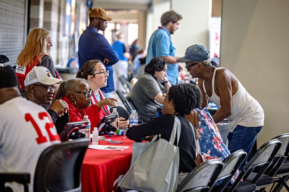 Survivors of the May 16 tornado receive support at the Disaster Assistance Center in Chaifetz Arena on June 17, 2025. The DAC, which serves as a central space for tornado-affected residents to connect with agencies and resources, is a partnership between the City of St. Louis, Missouri State Emergency Management Agency and SLU. Photo by Sarah Conroy.
