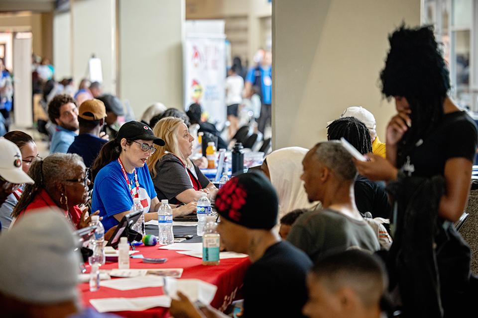 Survivors of the May 16 tornado receive support at the Disaster Assistance Center in Chaifetz Arena on June 17, 2025. The DAC, which serves as a central space for tornado-affected residents to connect with agencies and resources, is a partnership between the City of St. Louis, Missouri State Emergency Management Agency and SLU. Photo by Sarah Conroy.
