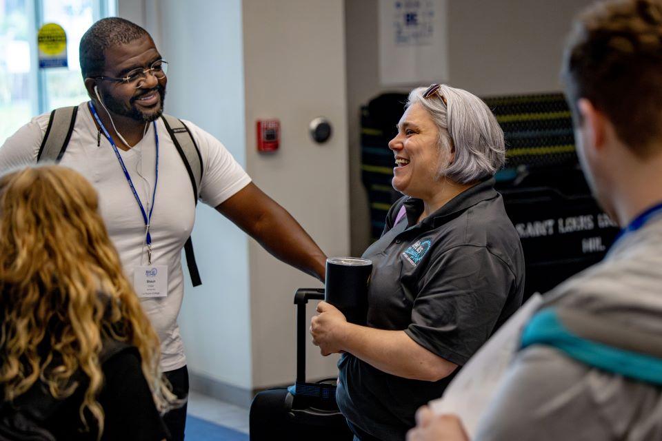 Jackie Weber, director of Student Involvement, center right, welcomes representatives from Jesuit schools to SLU for the 2025 National Jesuit Student Leadership Conference on July 22, 2025. Photo by Sarah Conroy.