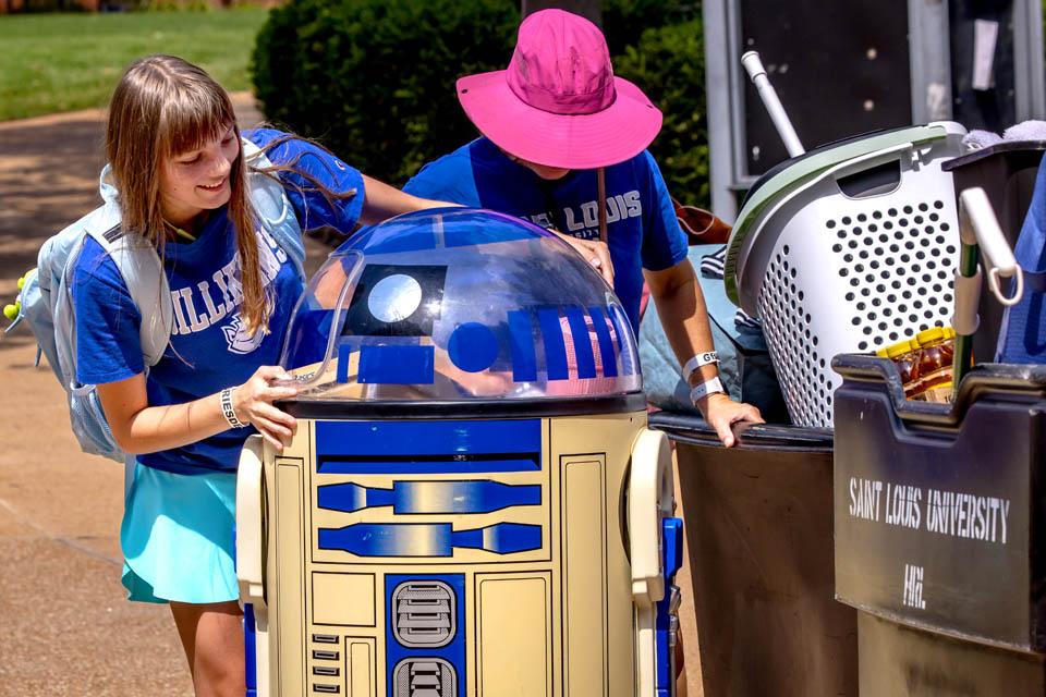 Families move into residence halls during first-year student move-in on Friday, Aug. 15, 2025. Photo by Sarah Conroy. 

