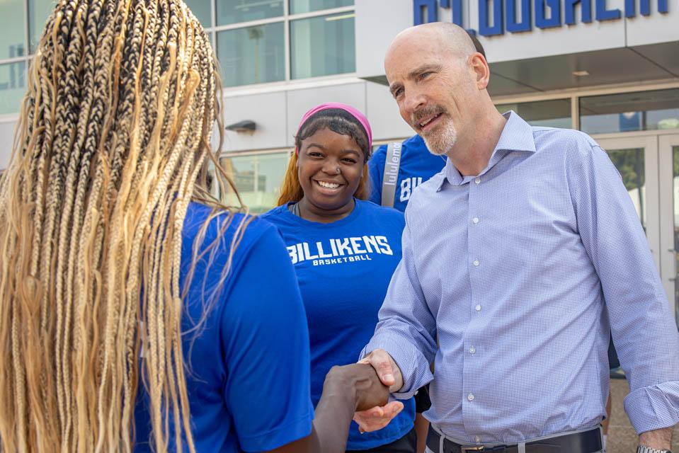 President Edward Feser, Ph.D., greets student athletes after Convocation on Aug. 16, 2025. Photo by Sarah Conroy.

