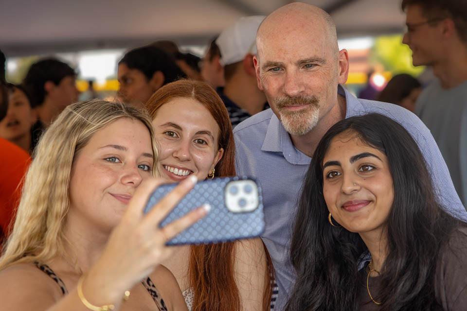 President Edward Feser, Ph.D., takes a selfie with new students after Convocation on Saturday, Aug. 16, 2025. Photo by Sarah Conroy. 

