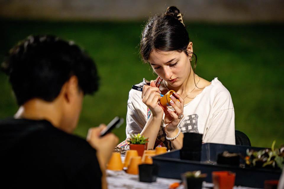 Students plant succulents during the Billiken Block Party on Aug. 16, 2025. Photo by Sarah Conroy.