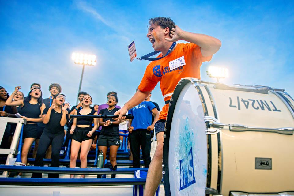 Oriflamme member Brendan Brunette leads a cheer during the soccer game on Aug. 16, 2025. Photo by Sarah Conroy.