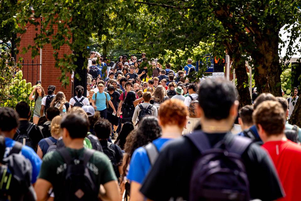 Students walk across Grand Avenue on the first day of fall classes.