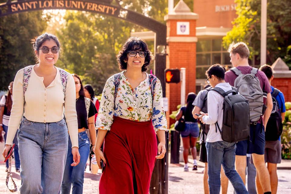 Students walk across Grand Avenue on the first day of fall classes.