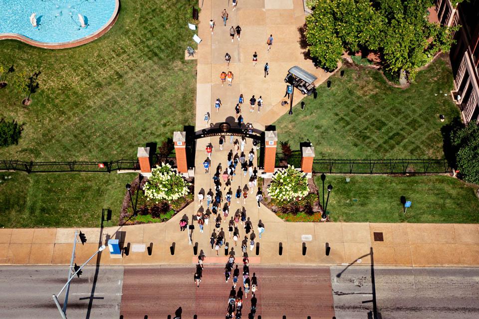 Students walk across Grand Avenue on the first day of fall classes.