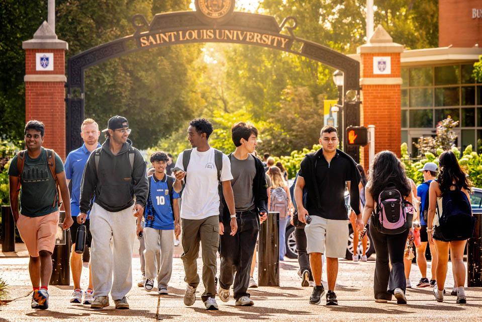 Students walk across Grand Avenue on the first day of fall classes.
