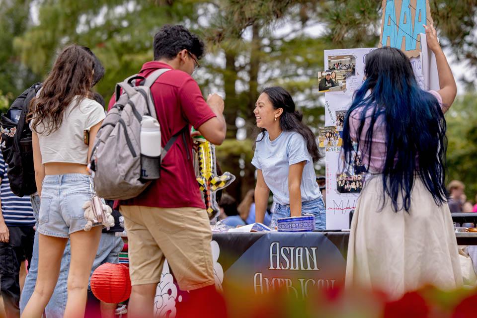 Students learn about campus clubs during the SLU Involvement Fair on Aug. 23, 2025. Photo by Sarah Conroy.