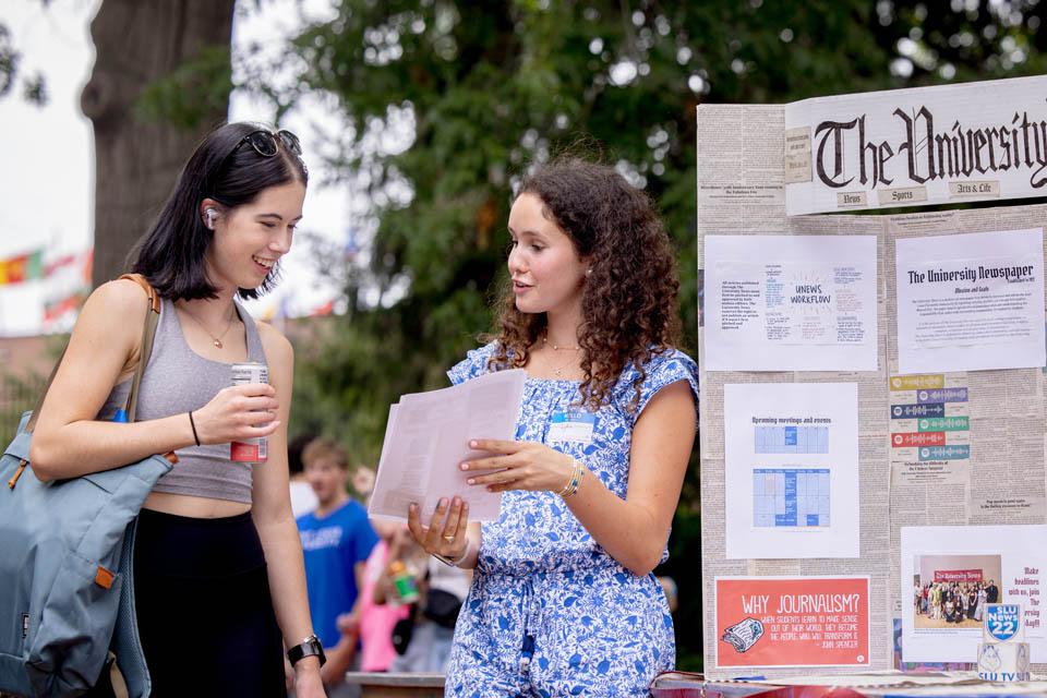 Students learn about campus clubs during the SLU Involvement Fair on Aug. 23, 2025. Photo by Sarah Conroy.
