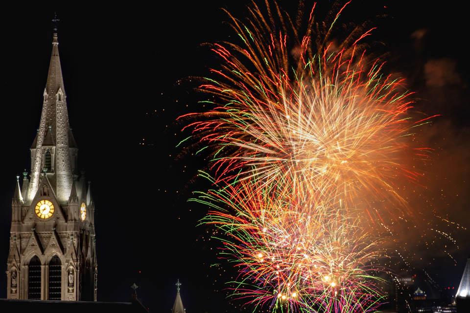 Fireworks explode near St. Francis Xavier College Church during Homecoming and Family Weekend on Sept. 27, 2025. Photo by Sarah Conroy. 