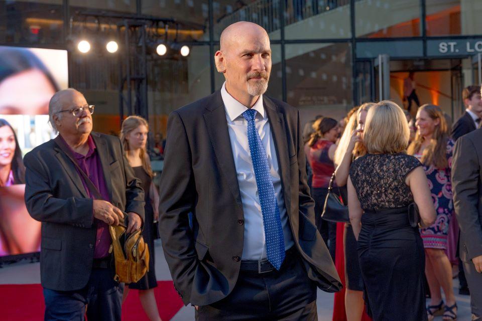President Edward Feser, Ph.D watches stars arrive on the red carpet during the world premiere of Soul on Fire at Powell Hall on October 2, 2025. Photo by Sarah Conroy. 