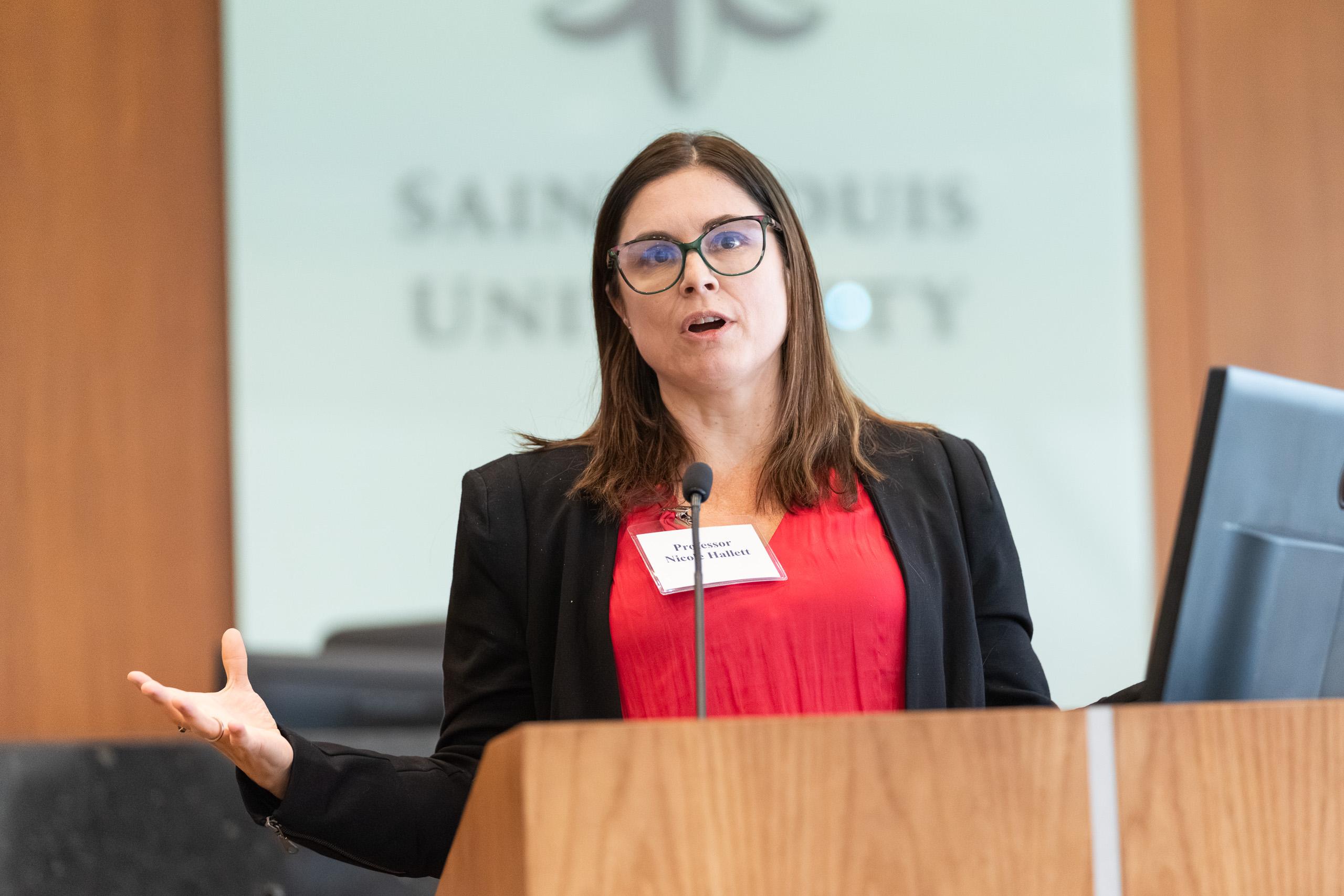 Professor Nicole Hallett, director of Immigrants’ Rights Clinic, University of Chicago Law School, speaks during the panel at the Childress Lecture
