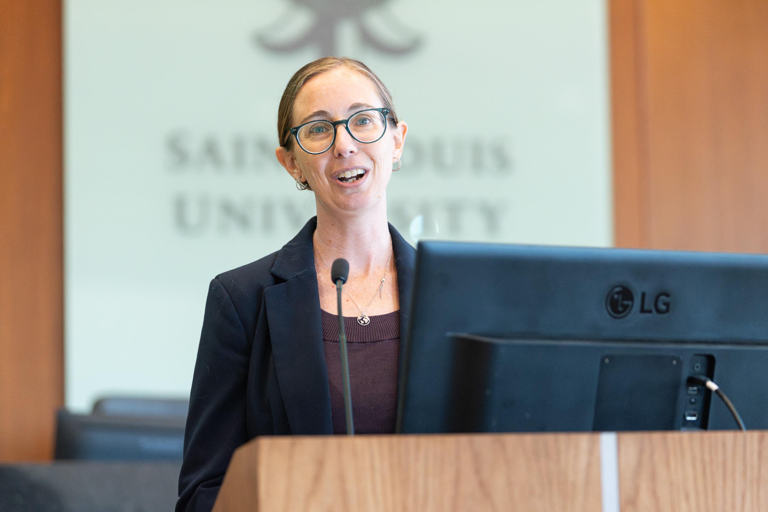 Jessica Mayo, an attorney with the MICA Project speaks on the panel during the Childress Lecture