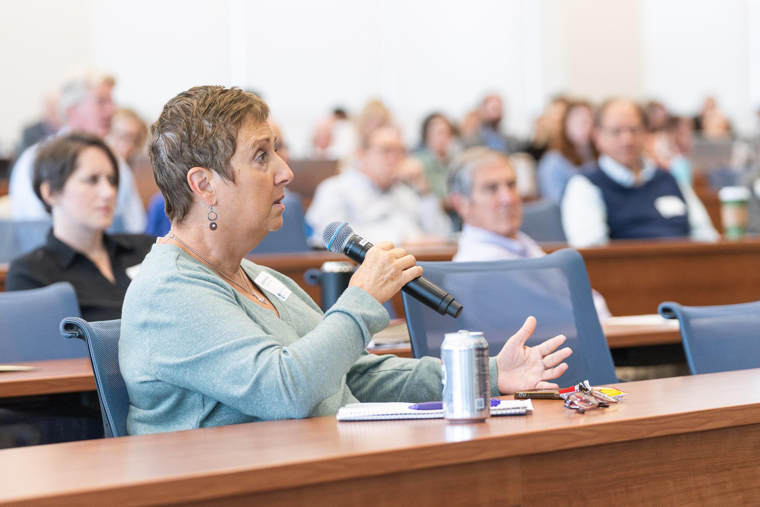 An audience member asks a question during the annual Childress Lecture