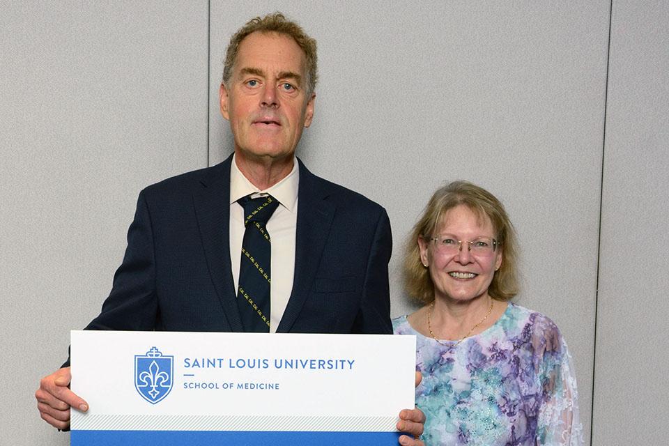A School of Medicine alum poses for a photo during SLU's 2025 Med Reunion. Photo by Sarti Photo Services.