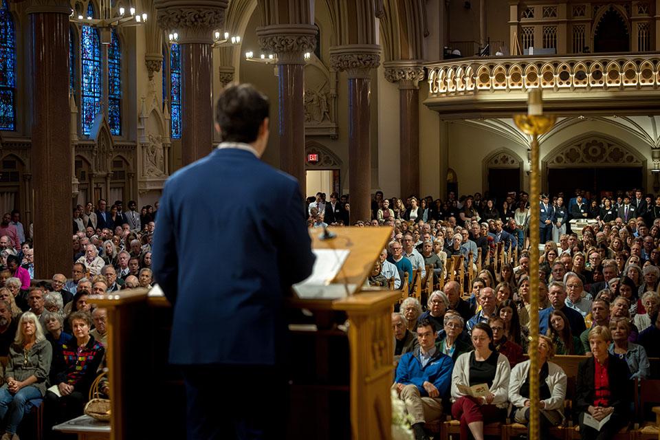 School of Medicine student Jake Dourdourekas offers a reflection during the Interfaith Memorial Service on Oct. 24, 2025.