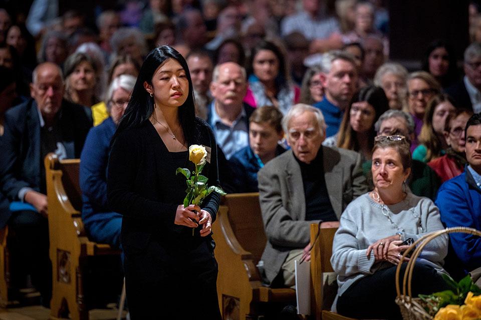 School of Medicine students offer yellow roses in memory of those who donated their bodies to the Gift Body program during the Interfaith Memorial Service on Oct. 24, 2025.