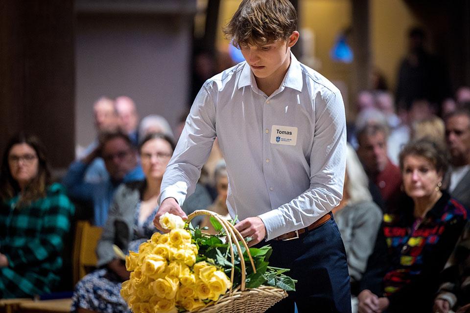 School of Medicine students offer yellow roses in memory of those who donated their bodies to the Gift Body program during the Interfaith Memorial Service on Oct. 24, 2025.