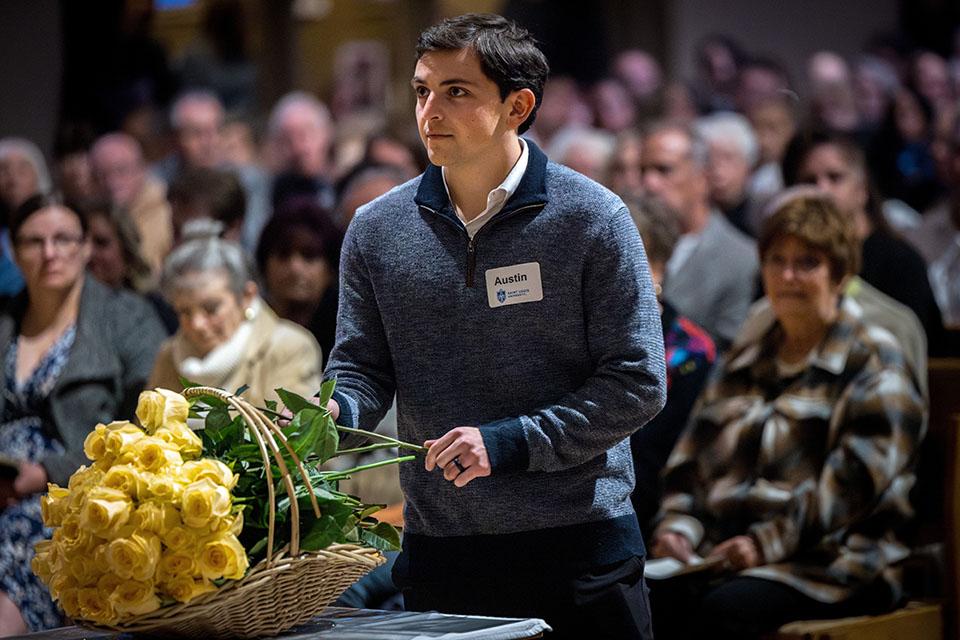 School of Medicine students offer yellow roses in memory of those who donated their bodies to the Gift Body program during the Interfaith Memorial Service on Oct. 24, 2025.