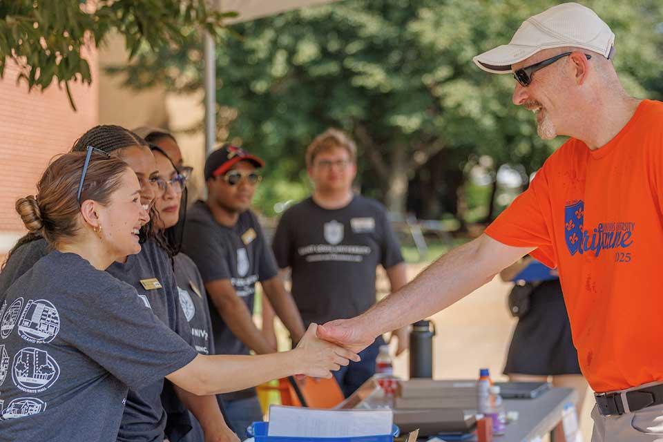 President Feser greets the Housing and Residence Life team during move-in on Aug. 15, 2025.