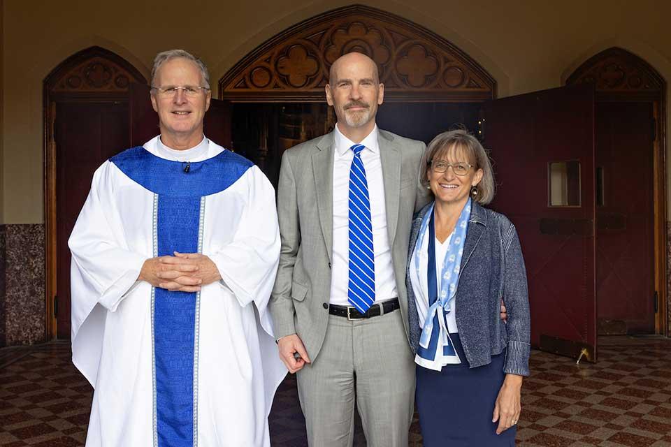 Fr. Thomas P. Greene, S.J., provincial superior of the Jesuits USA Central and Southern Province, with the Fesers after President Feser was missioned at the Mass of the Holy Spirit on Aug. 22, 2025.