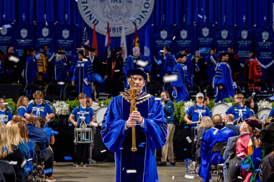 SLU President Edward Feser, Ph.D., leaves the inauguration ceremony on Wednesday Nov. 5, 2025. Photo by Sarah Conroy.