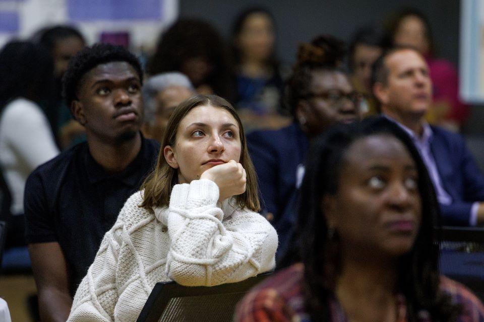 Attendees watch a video during the William L. Clay Sr. Institute of Civic Engagement and Economic Justice Open House on November 11, 2025. Photo by Sarah Conroy. 