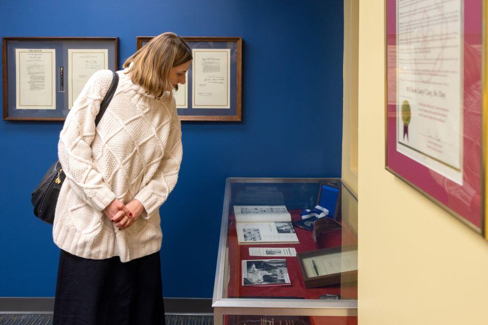 An attendee looks at the display in the William L. Clay Sr. Institute of Civic Engagement and Economic Justice at the Open House on November 11, 2025. Photo by Sarah Conroy. 