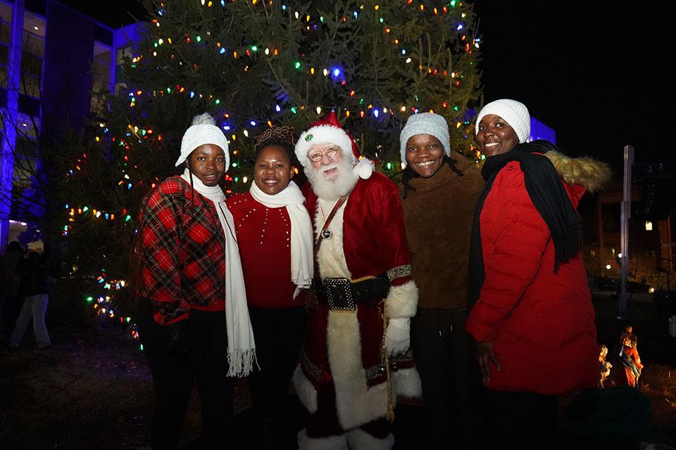 Santa poses for photos with attendees during Christmas on the Quad on Dec. 6, 2025. Photo by Megan Favignano Mansouri.