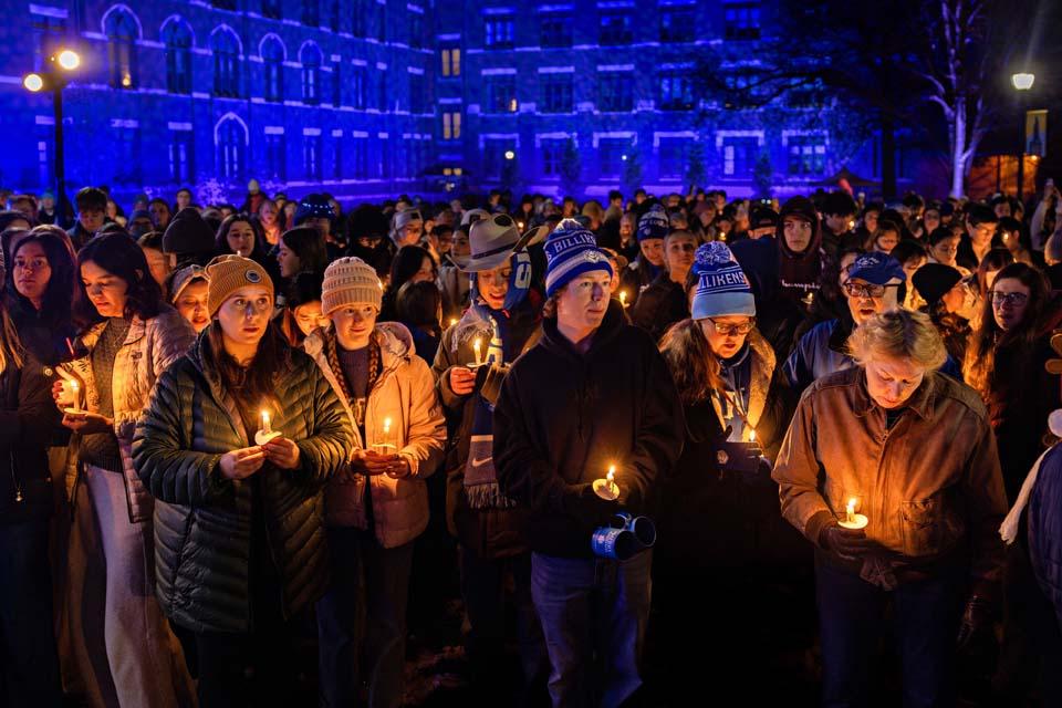 Attendees gather on the quad with candles during Christmas on the Quad on Dec. 6, 2025. Photo by Sarah Conroy.