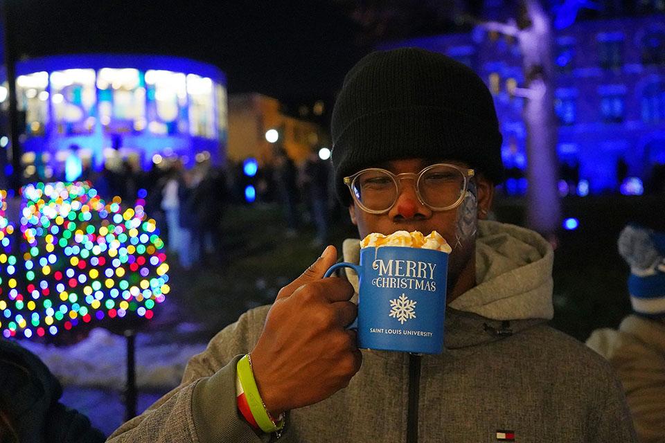 Attendees enjoy hot chocolate during Christmas on the Quad on Dec. 6, 2025. Photo by Megan Favignano Mansouri.