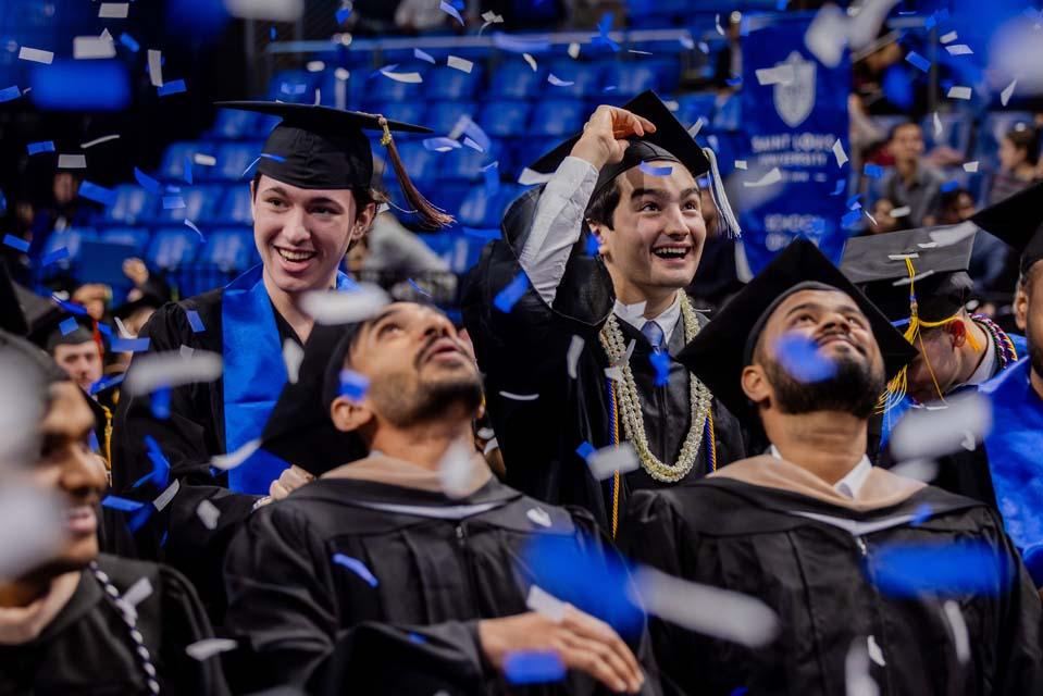 Graduates watch as confetti falls during Midyear Commencement on Saturday, Dec. 13, 2025. Photo by Sarah Conroy.