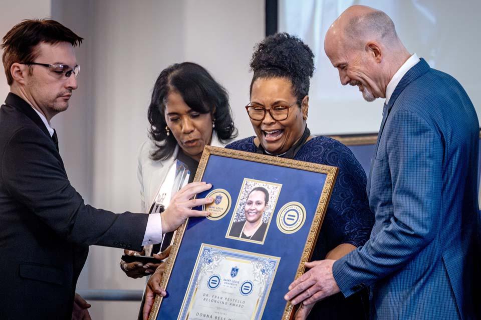 Donna Bess Myers, former Dean of Students, center, reacts to receiving the Dr. Fran Pestello Belonging Award during the 2026 Martin Luther King Jr. Memorial Tribute on January 22, 2026. Photo by Sarah Conroy.

