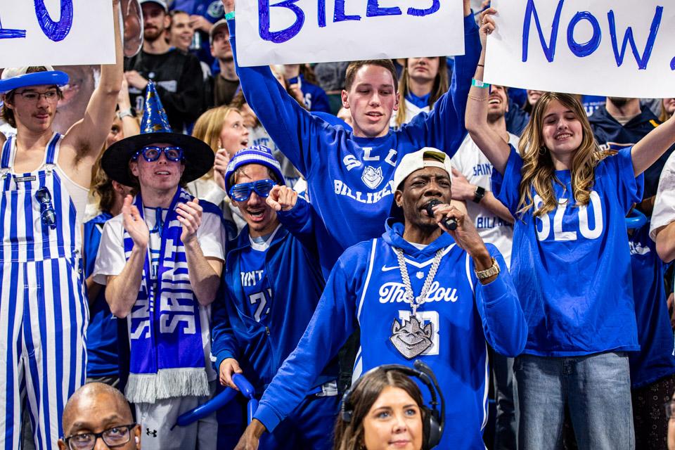 SLU student crowd with emcee Dre as admitted students celebrate attending the men's basketball game vs. La Salle