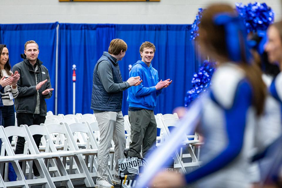 Admitted students and their families clap to a newly learned SLU cheer.