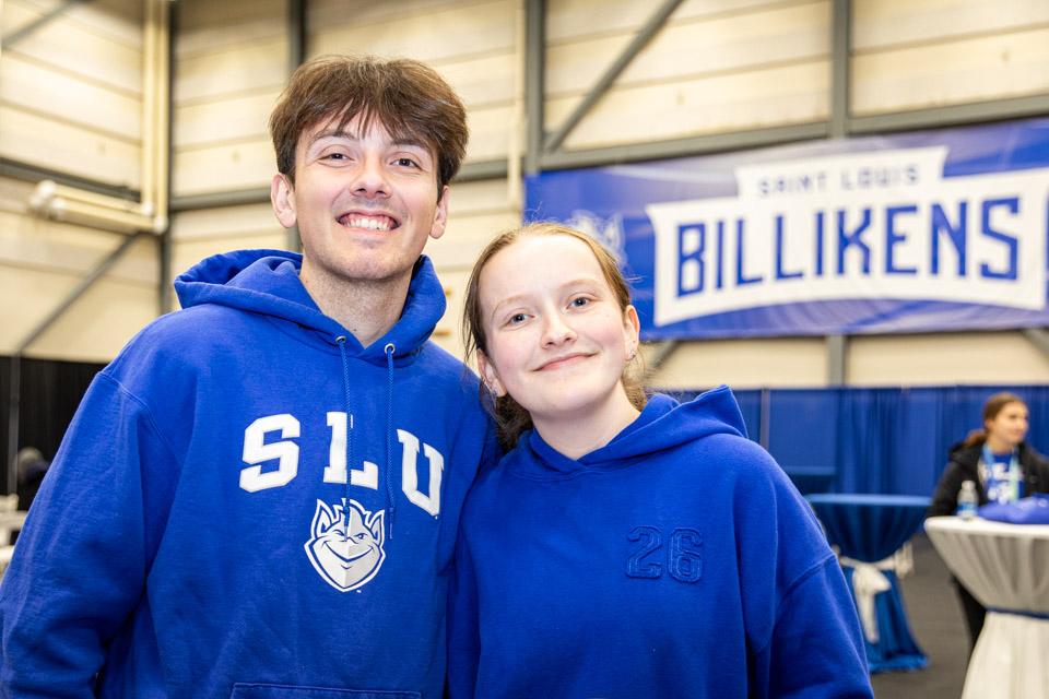 Two admitted students pose during the pre-game party for men's basketball vs. La Salle.