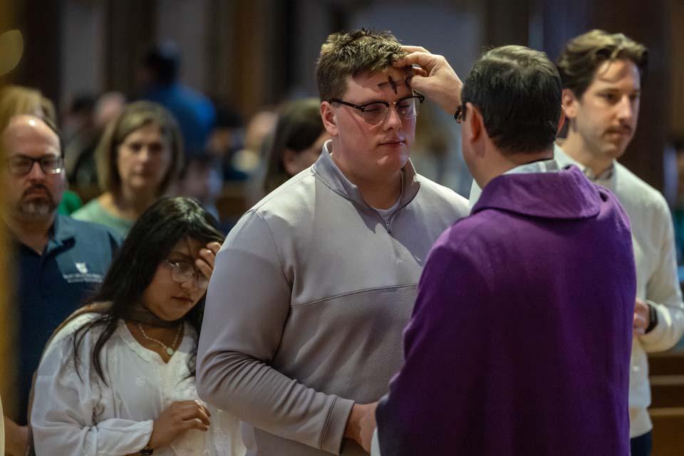 A member of the SLU community receives ashes during Ash Wednesday Mass on Feb. 18, 2026. Photo by Sarah Conroy.