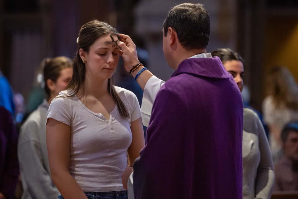 A member of the SLU community receives ashes during Ash Wednesday Mass on Feb. 18, 2026. Photo by Sarah Conroy.