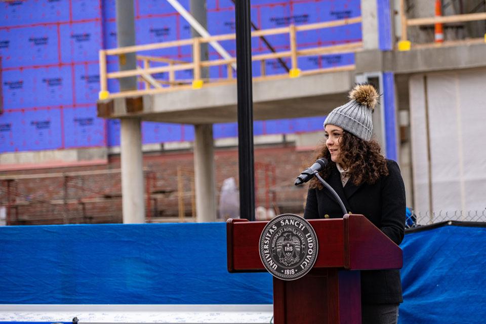 Senior Maleah Fallahi, president of the Student Government Association, speaks at the pre-top-out ceremony. Photo by Steve Long