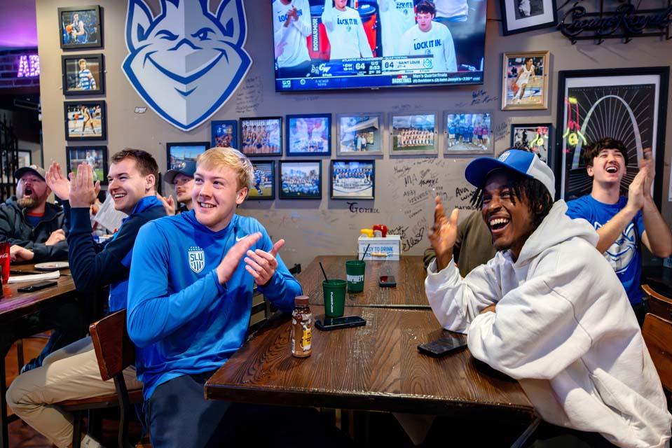 Billikens fans react as they watch the A-10 quarterfinal game against George Washington University during a watch party at Humphrey’s Restaurant and Tavern on March 13, 2026. The Billikens won 88-81. Photo by Sarah Conroy.