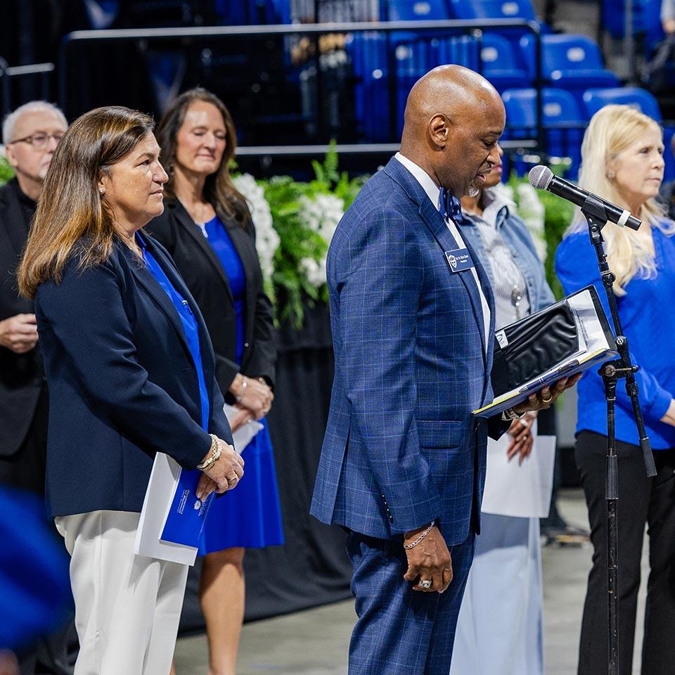 Feser's inauguration also included greetings from faculty, staff, students and members of the St. Louis community, such as (center) Dr. H. Eric Clark (Grad Ed '99, '14), president of Loyola Academy of St. Louis.