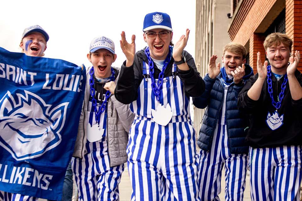 a group of men wearing striped outfits
