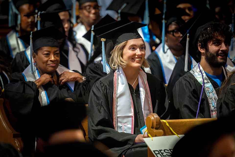 Graduates from the School of Education listen during their precommencement on May 14, 2026. Photo by Sarah Conroy.&nbsp;