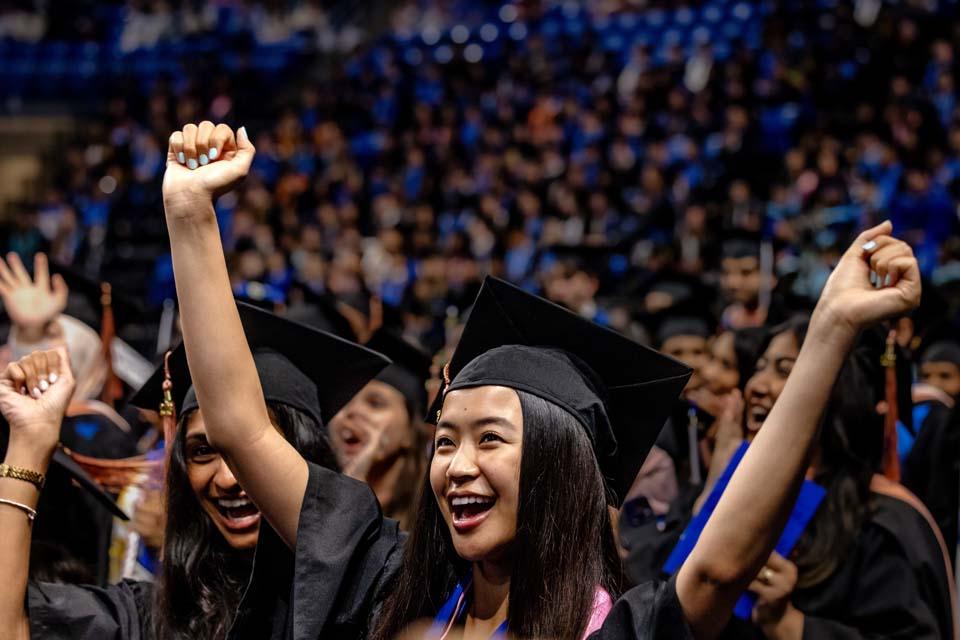 A SLU graduate cheers during commencement on Saturday, May 16, 2026. Photo by Sarah Conroy.